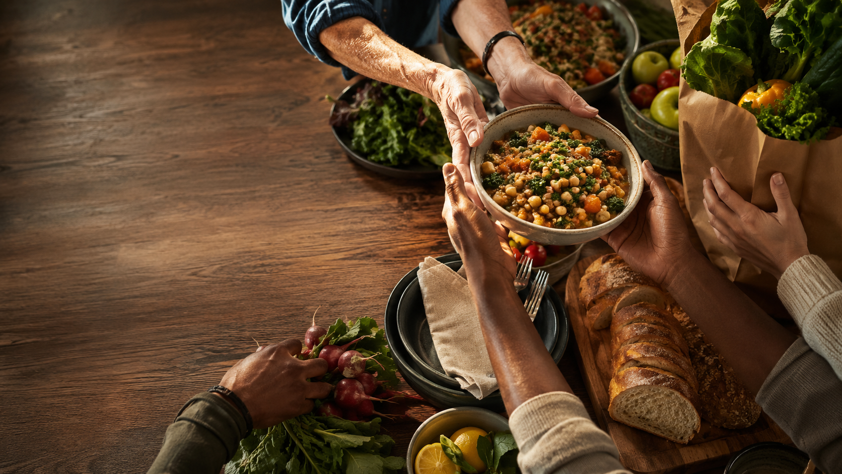 People sharing a wholesome meal and fresh groceries around a community table